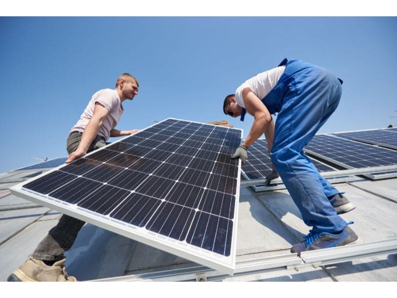 installing-solar-photovoltaic-panel-system-on-roof-2022-05-16-16-02-46-utc