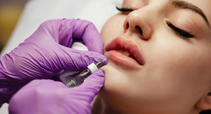 close-up-woman-getting-botox-her-lips_88340-4521