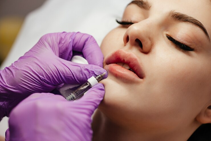 close-up-woman-getting-botox-her-lips_88340-4521