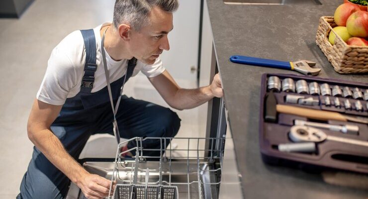 dishwasher-repair-top-view-middleaged-man-crouching-near-open-dishwasher_259150-58282 (3)