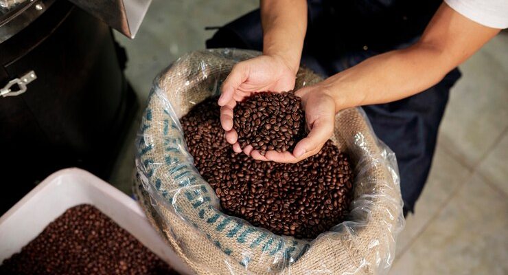 man-examining-coffee-beans_274689-3364