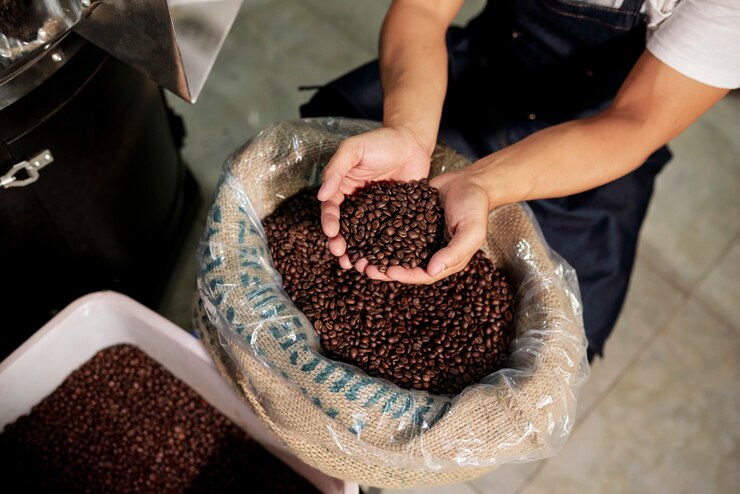 man-examining-coffee-beans_274689-3364