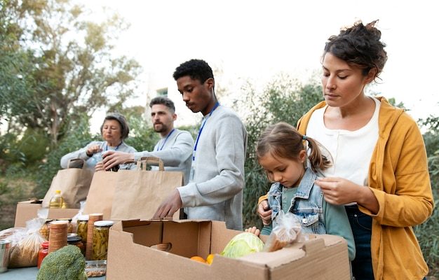 medium-shot-people-collecting-food_23-2149182019