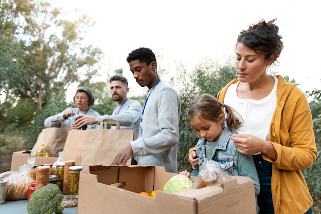 medium-shot-people-collecting-food_23-2149182019