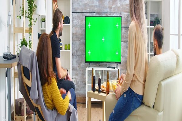 back-view-close-friends-with-hands-air-while-watching-football-match-living-room