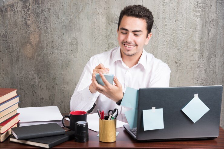 office-employee-playing-with-telephone-office-desk_114579-28385