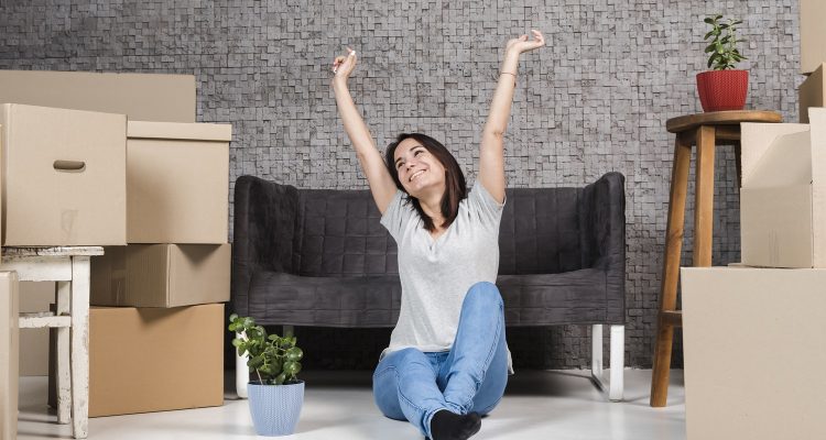 portrait-young-woman-celebrating-relocation