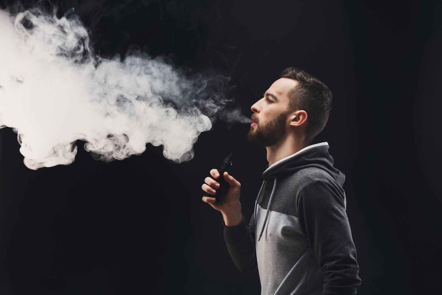 young-man-vaping-studio-shot-bea