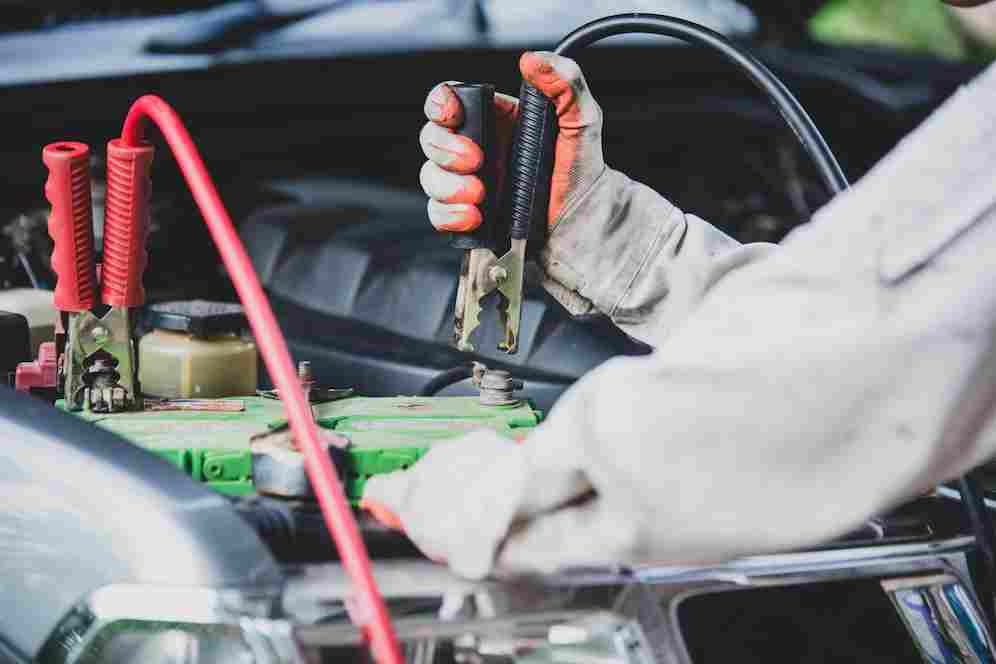 car-repairman-wearing-white-uniform-standing-holding-wrench-that-is-essential-tool-mechanic_1150-16588