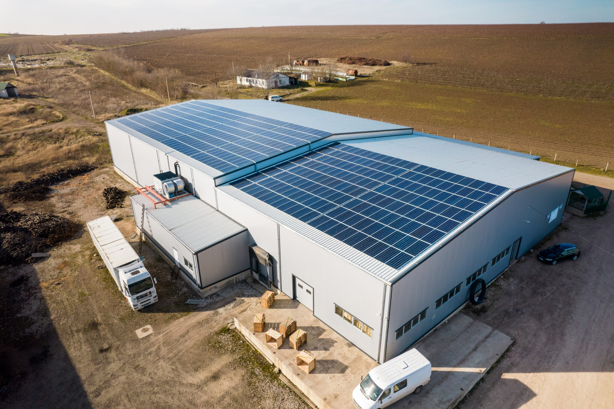 multiple-solar-panels-roof-manufacturing-building-2048x1364