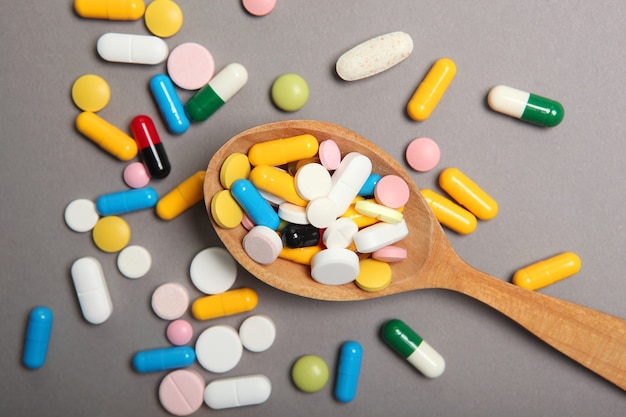 pills-colored-background-top-view-medicine-treatment-illness_441923-8841
