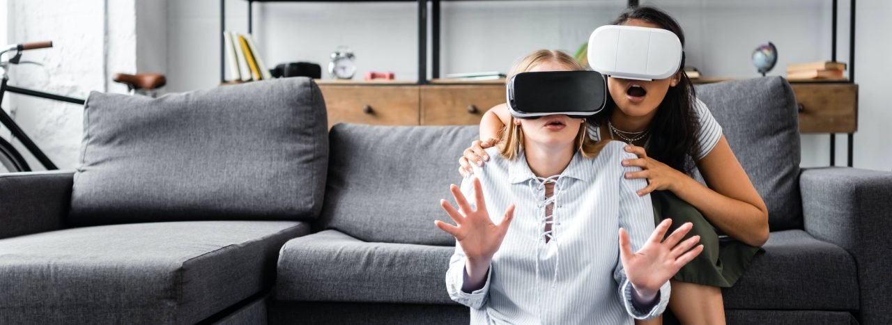 panoramic-shot-of-multicultural-friends-with-virtual-reality-headsets