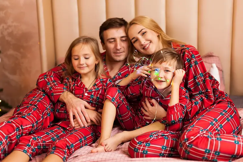family-portrait-pajamas-lying-bed-scaled
