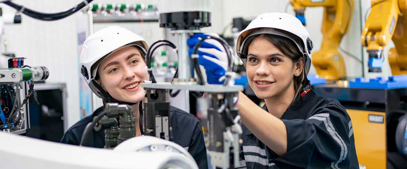 female-engineer-man-working-at-industrial-robot-in-DD248CV